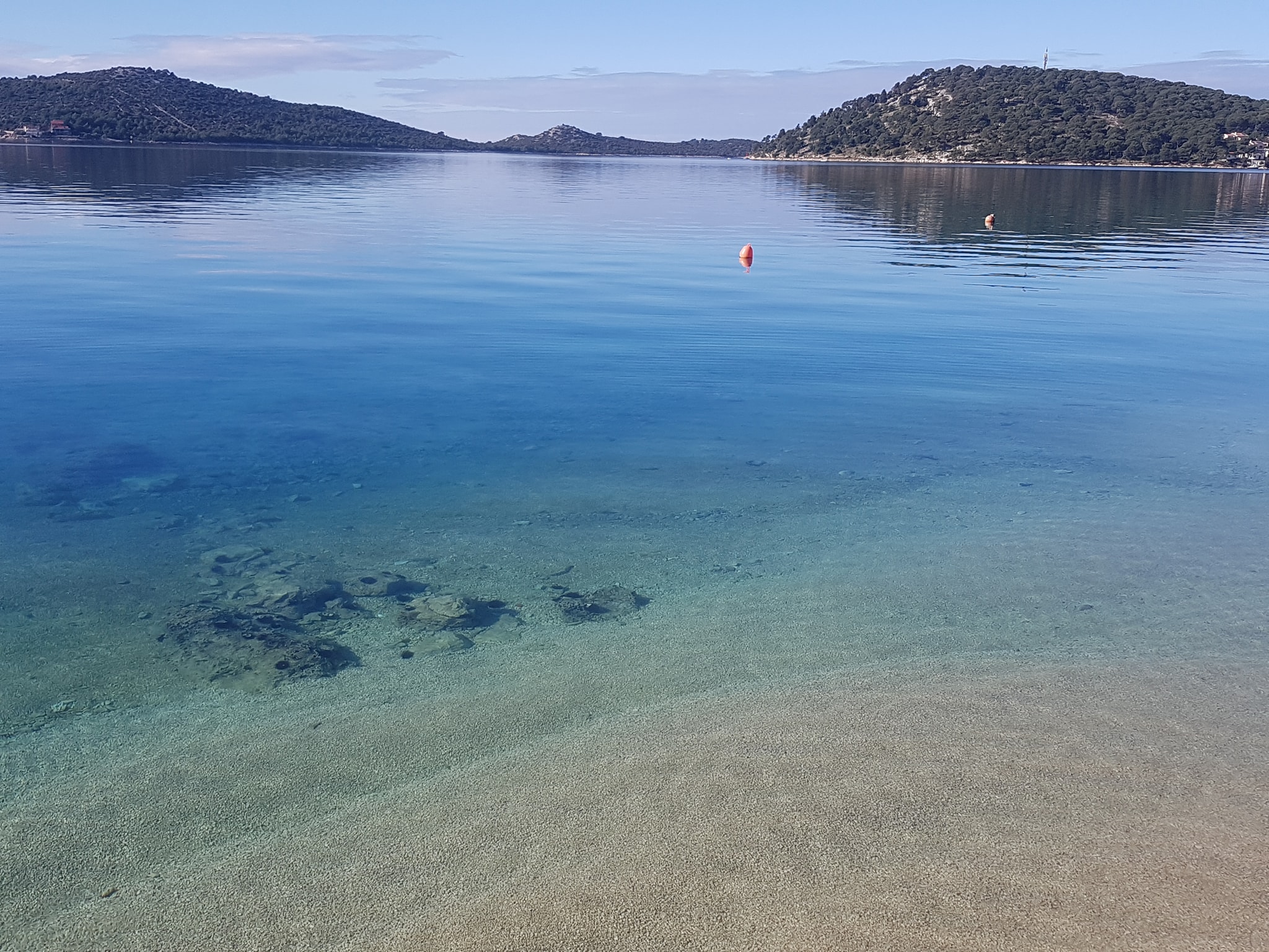 The bay · Still, clear and all yours